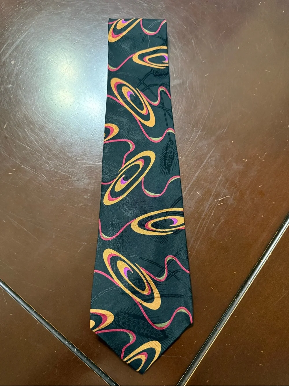 Black Tie with Orange and Pink Orbital Pattern
